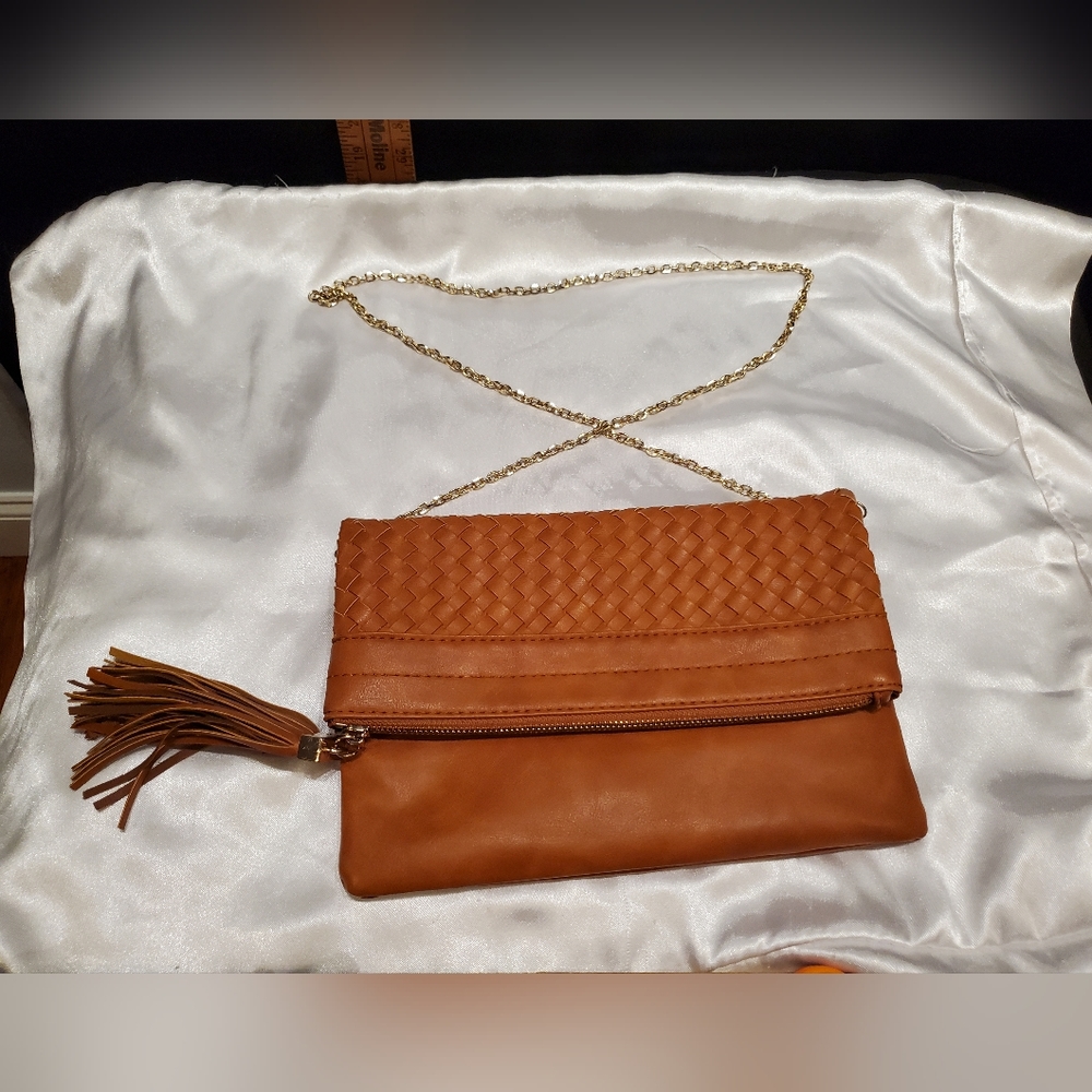 Woven Faux Leather Fold Over Purse with Tassle.